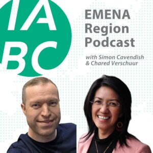 Cover image for the IABC EMENA Region Podcast. The green IABC logo appears on the left. The text reads “EMENA Region Podcast with Simon Cavendish & Chared Verschuur.” On the right side are two hosts: a smiling man in a dark shirt and a smiling woman wearing glasses, a pink blazer, and earrings, both against a white background with light green digital dots.